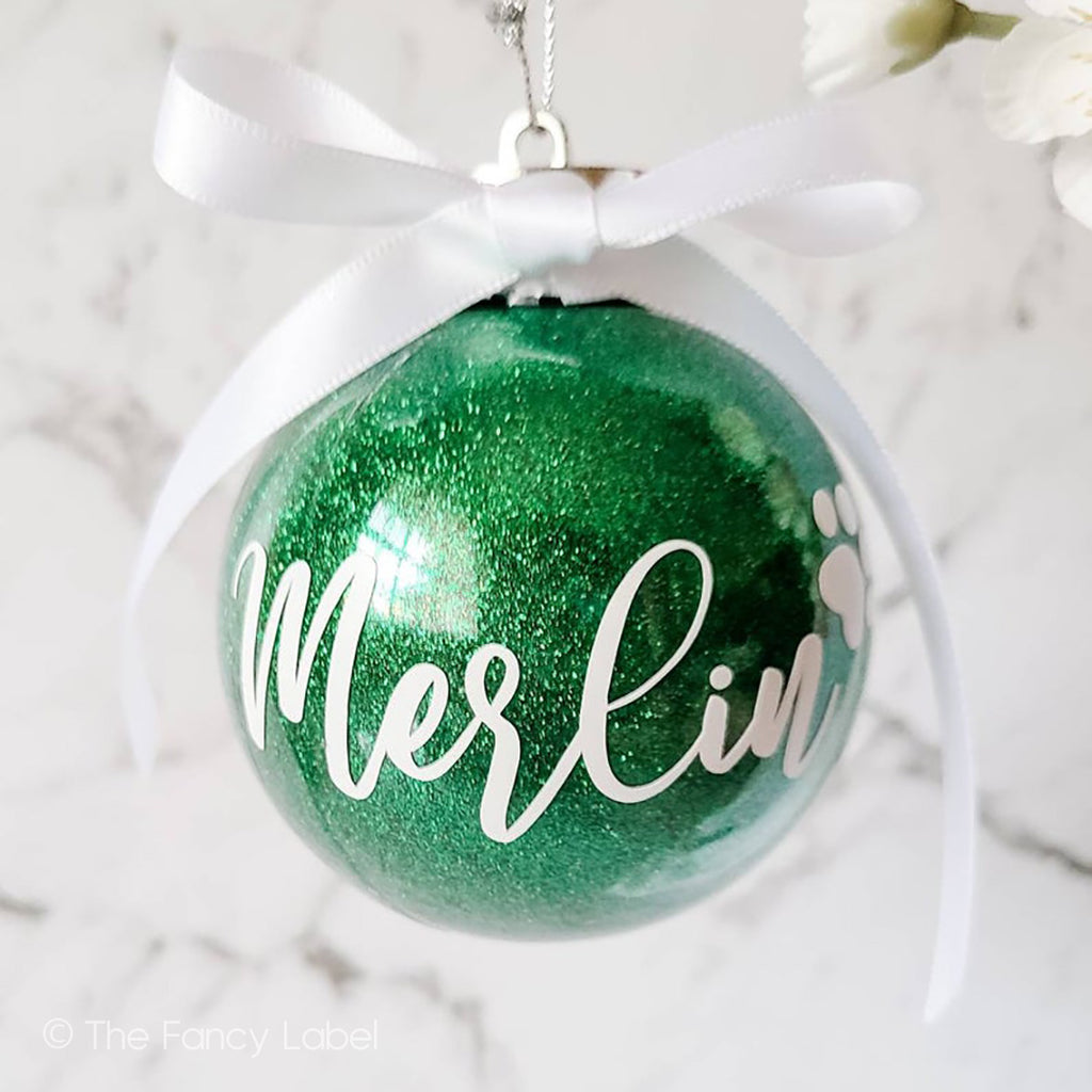 Pet name personalised christmas bauble with glitter and bow and paw print